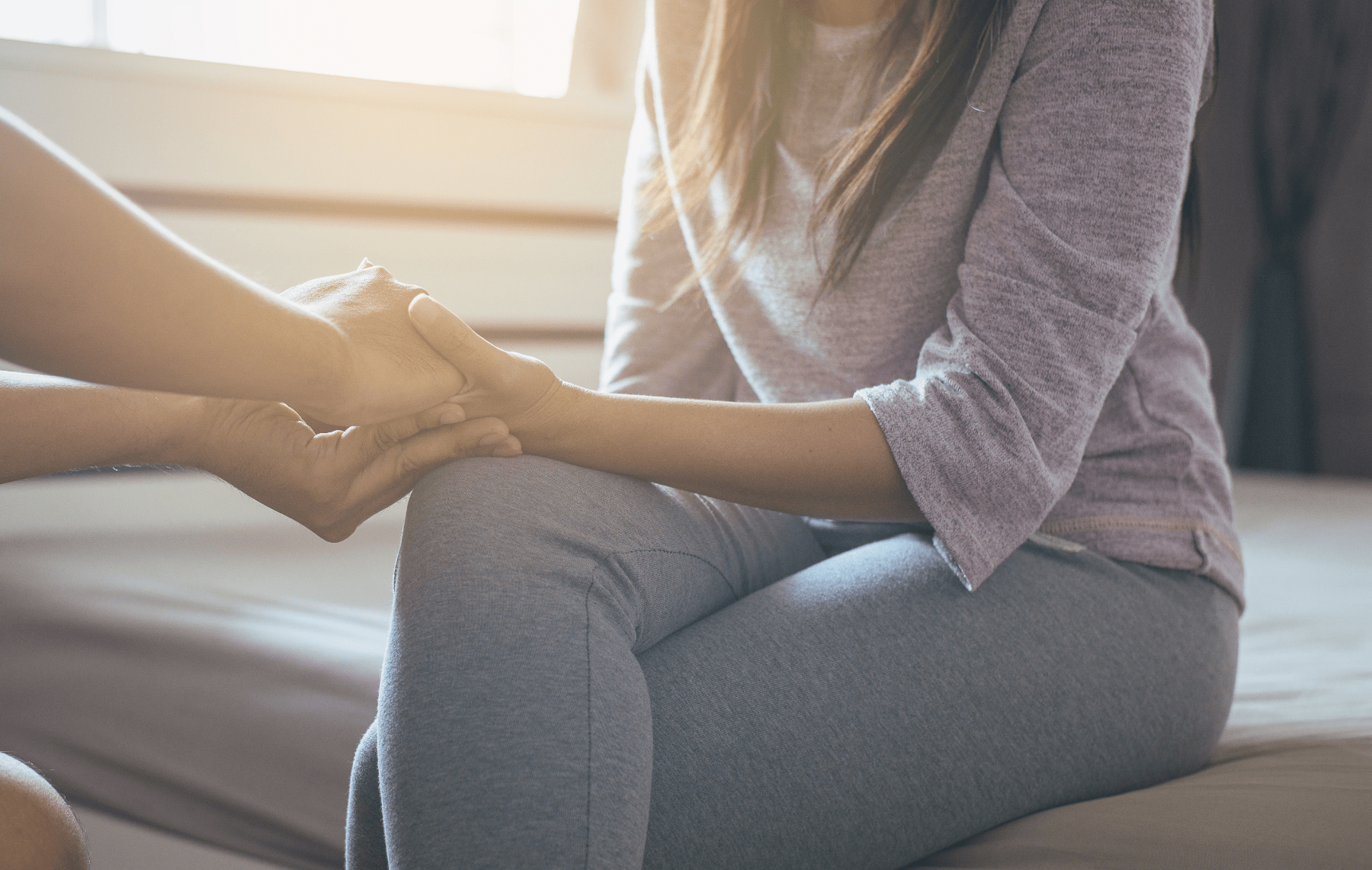 people-sitting-and-holding-hands_215384318-min